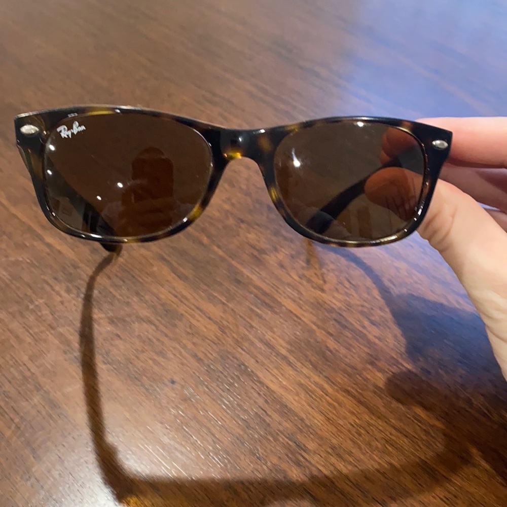 Smaller tortoise shell ray ban wayfarer sunglasses.